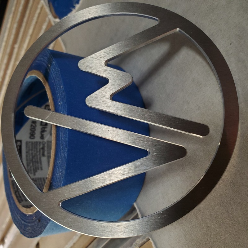 cnc router cut solid aluminum customer logo with chamfered edges